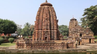a large stone structure sitting next to a body of water