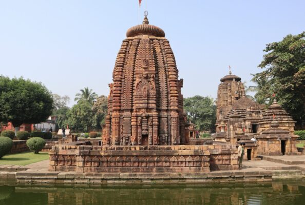 a large stone structure sitting next to a body of water