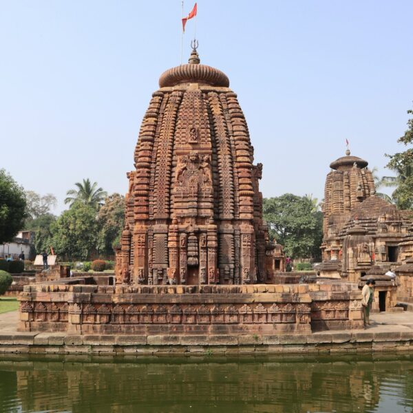 a large stone structure sitting next to a body of water